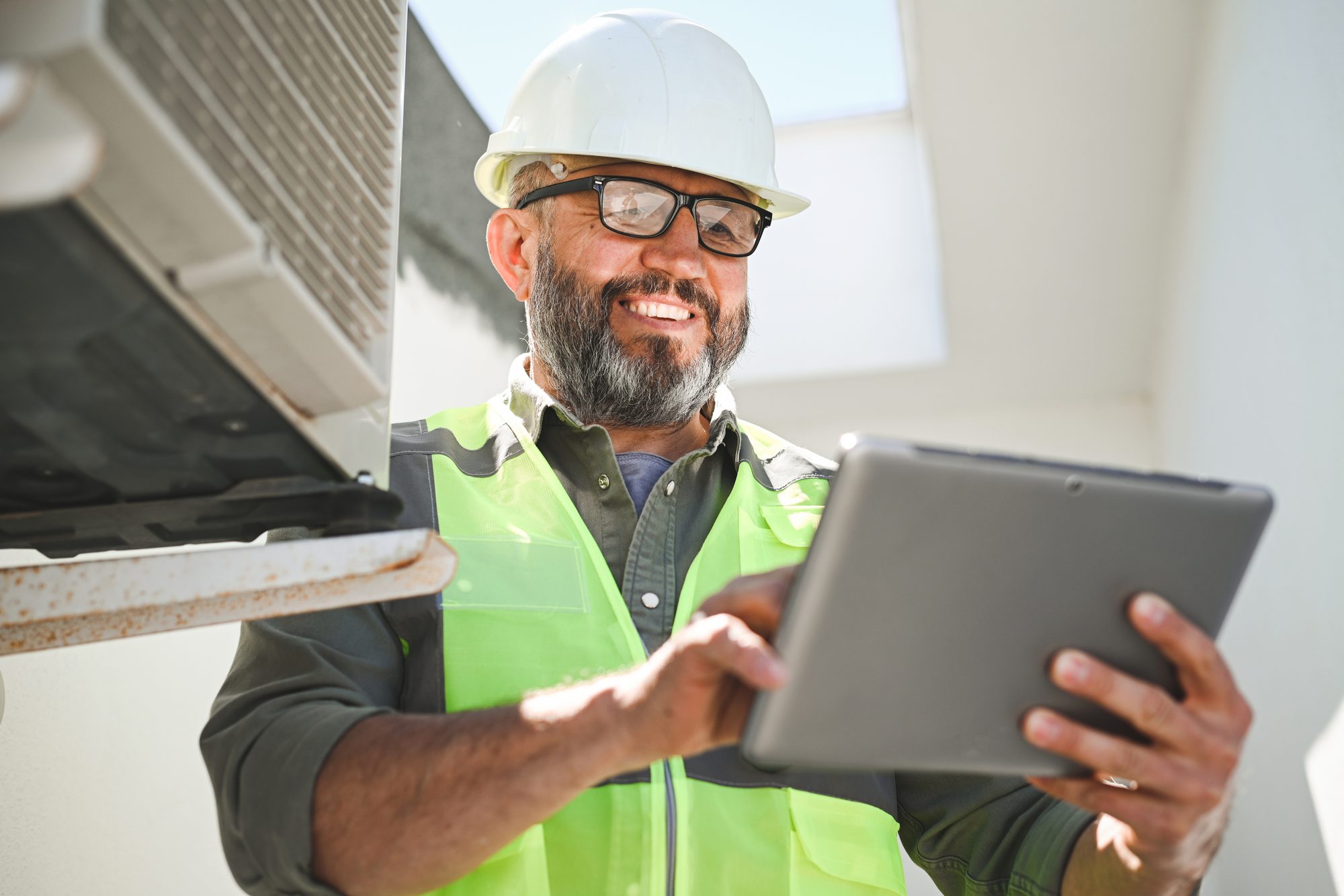 Field technician reviewing data on tablet