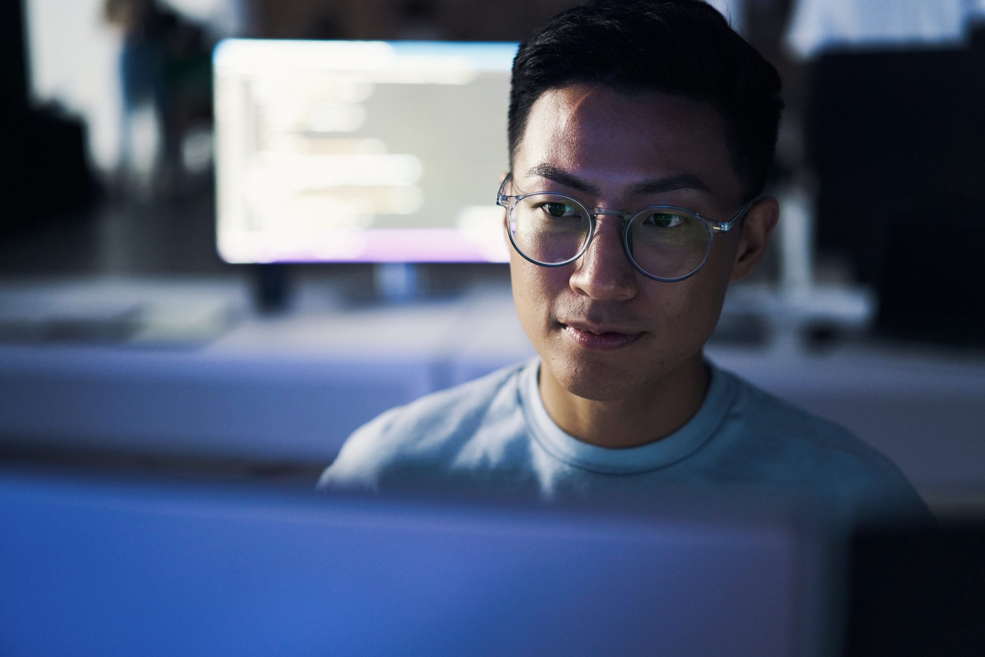 Analyst monitoring behavior data on screen